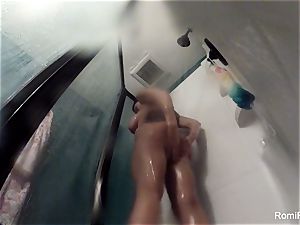 adult movie star Romi Rain brings her camera in the shower